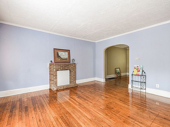 Living Room w/ decorative Fireplace.