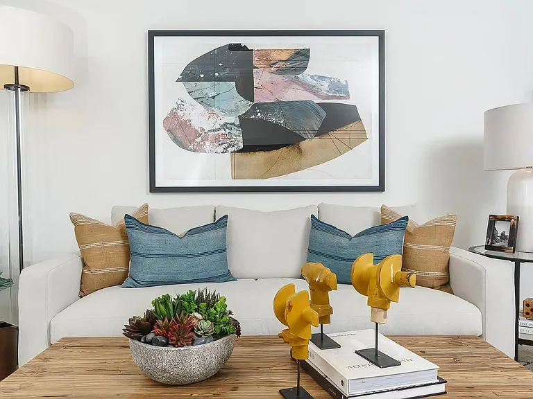 Comfortable Living Room Featuring Plush Sofa and Tabletop Accents