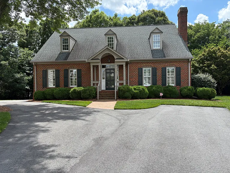 Classic Executive Home Offering Main-Level Living and Exceptional Privacy