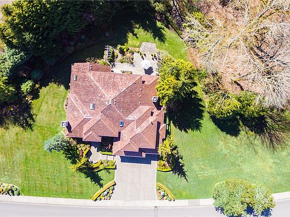 Top down photo of this beautifully landscaped property / Shy an Acre of level yard space!