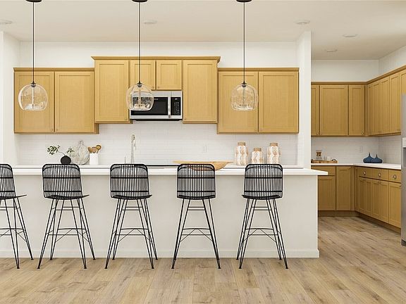 Extra large Island and additional butlers counter and pantry on the right.