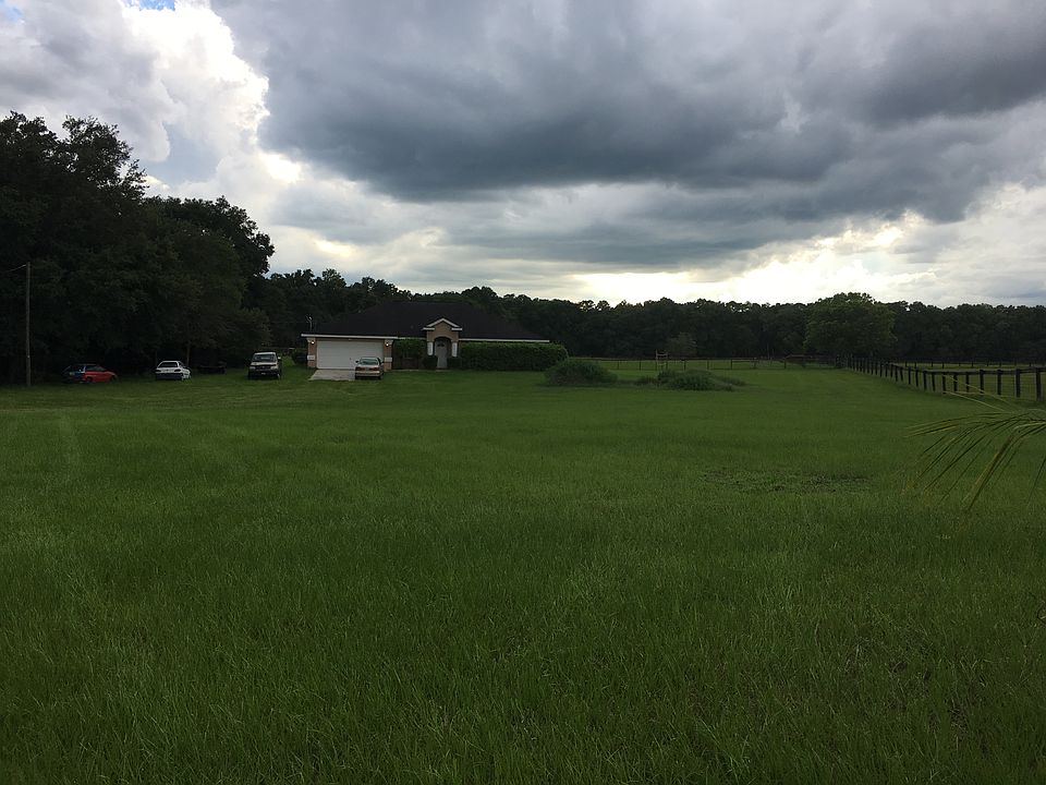 Drive opens to view of home