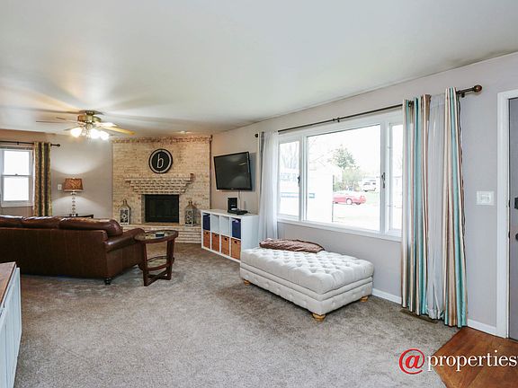 Living Room with brick wood burning fireplace