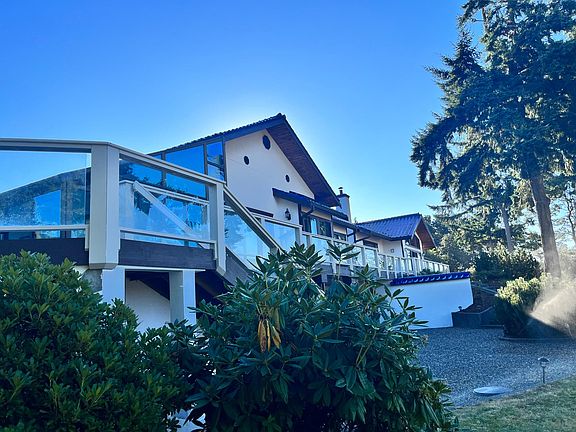 Back of house with full deck