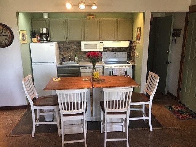Fully stocked kitchen with full size stove/oven, dishwasher,