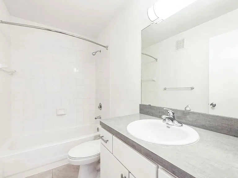 Enjoy a modern bathroom with a sleek bathtub, creating the perfect space for a calming retreat.