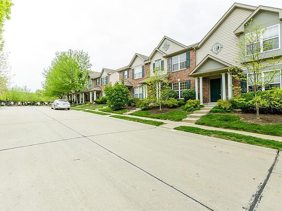 Outside of the property. Stairs lead to the townhouse.