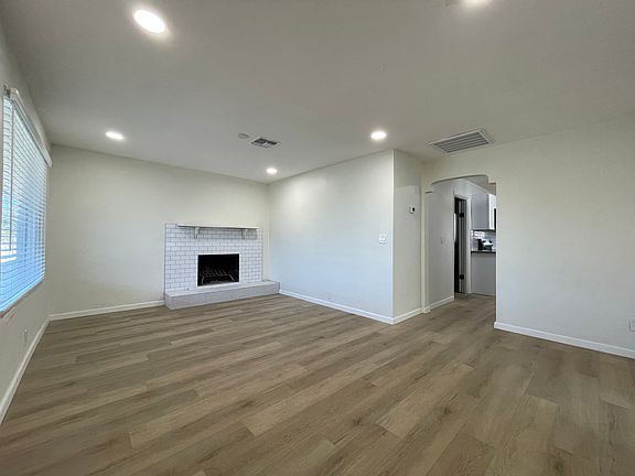 Living Room with fireplace and new luxury vinyl flooring
