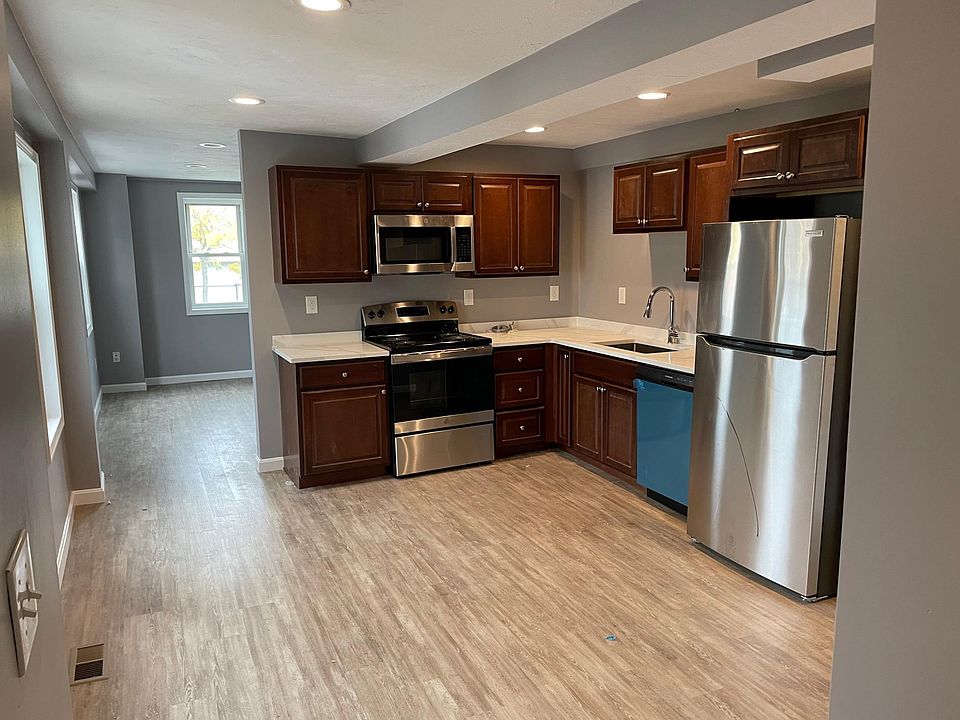 Newly renovated kitchen with stainless steel appliances and granite