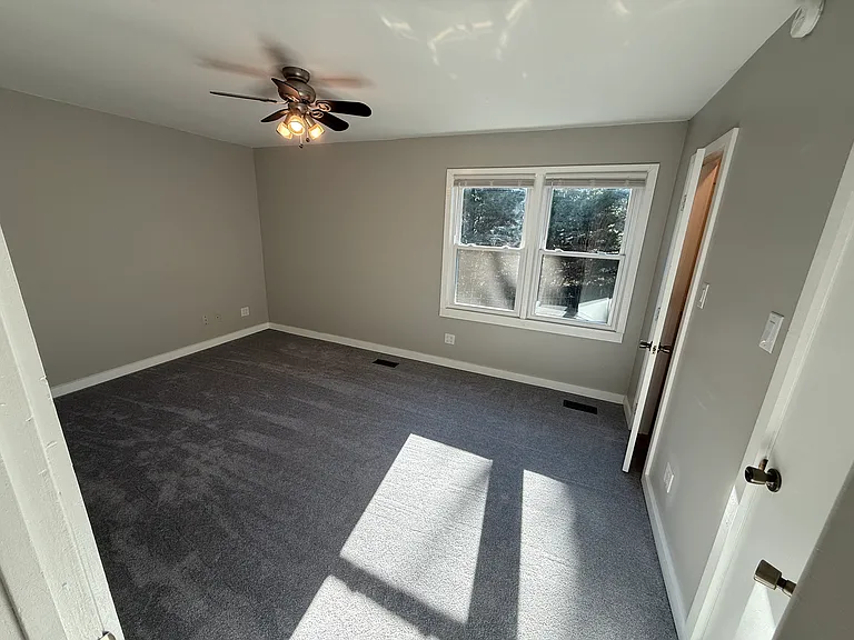 Rear bedroom view from hall
with ceiling fan with LED lights
Energy-efficient windows
