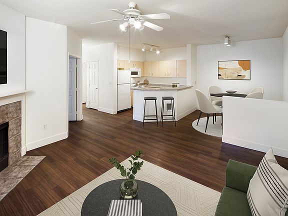 Kitchen, living room, and dining room with hard surface flooring (select homes)