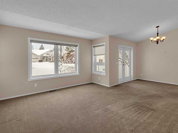 3rd image of 114 Macewan Ridge Vlg NW