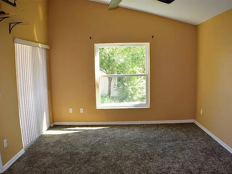 Master bedroom with the sliding glass door get out to the patio