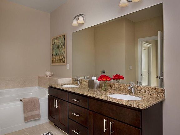 All master bathrooms have soaking tub, glass shower, double
