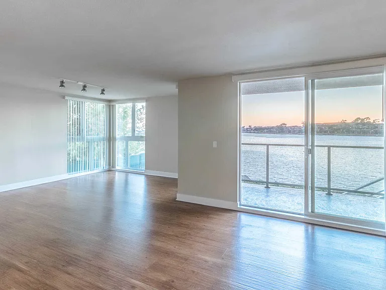 Living Room with Balcony and Floor-to-Ceiling Windows