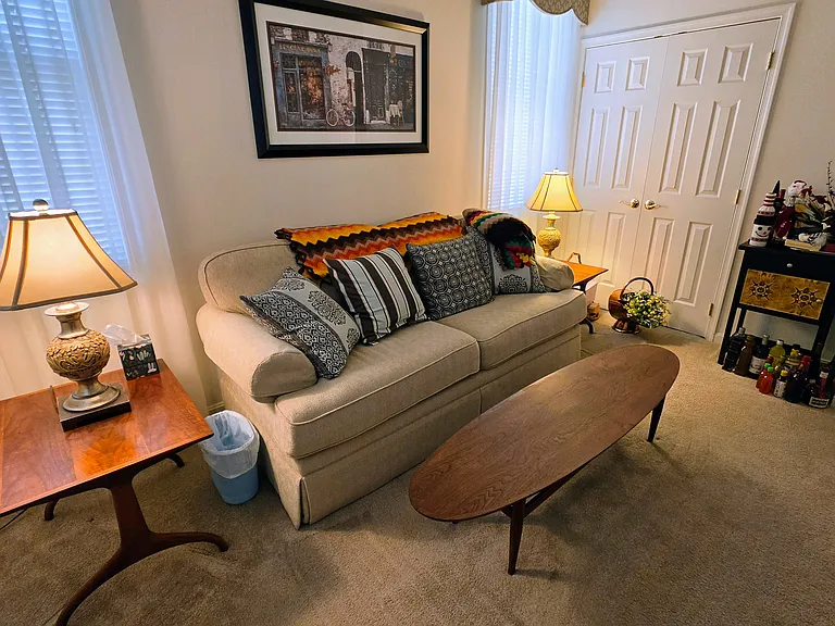 A cozy, sunlit bedroom retreat offering excellent closet space and a versatile footprint for any furniture arrangement.
