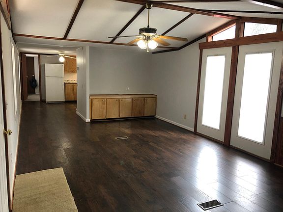 Family with built-ins open to kitchen