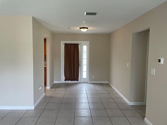 Dining room with door to backyard.