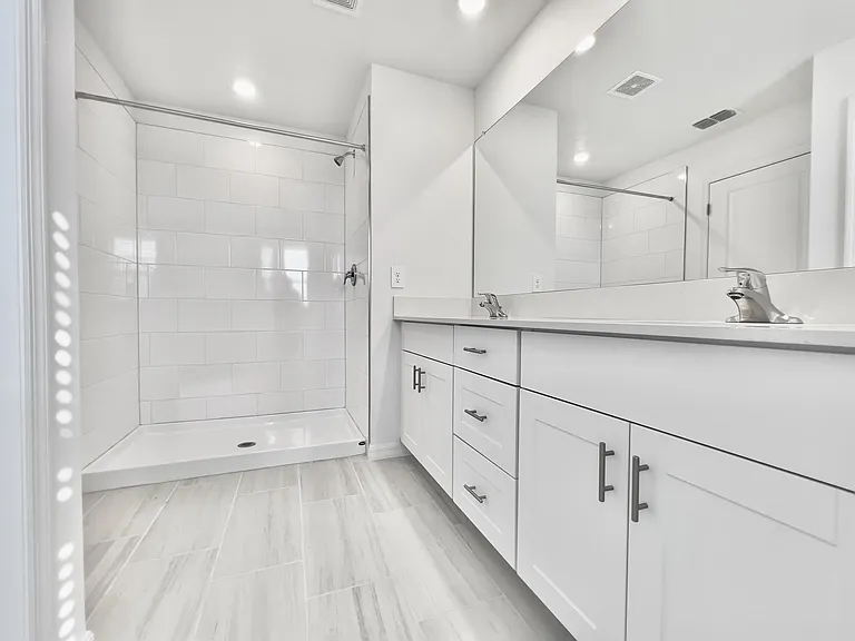 Master Bath with Double Vanity and standing shower