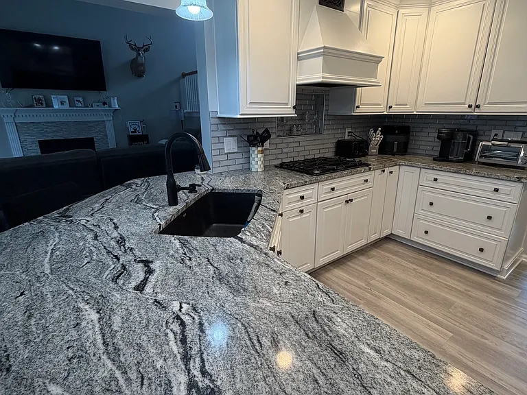New Granite Countertops opens up to the living room