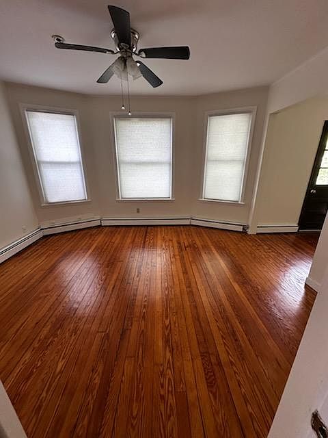 Formal Dining Room with Bow Windows and Built-In Hutch