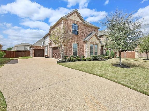 Notice the spacious 3 car garage with upgraded cedar doors!