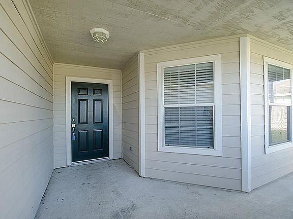 Nice covered front porch with room for sitting area.