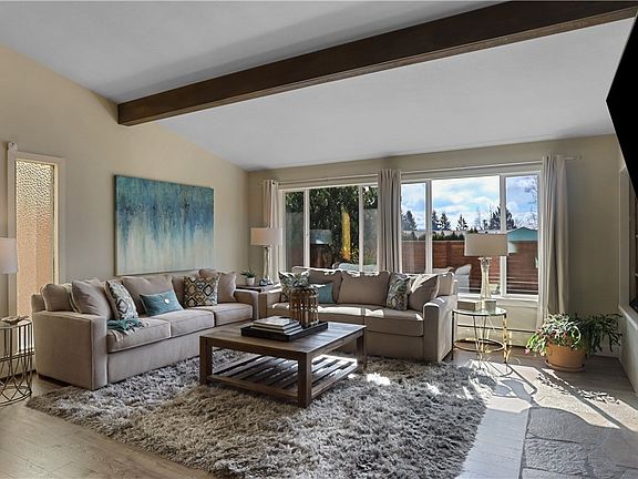 Cozy living room with vaulted ceiling.