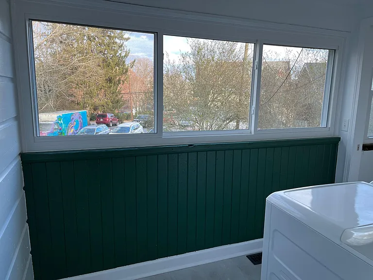 Laundry room looks out over the back yard.