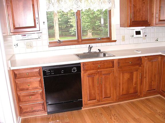 Quality Cherry Cabinets and New Kitchen applicances included.