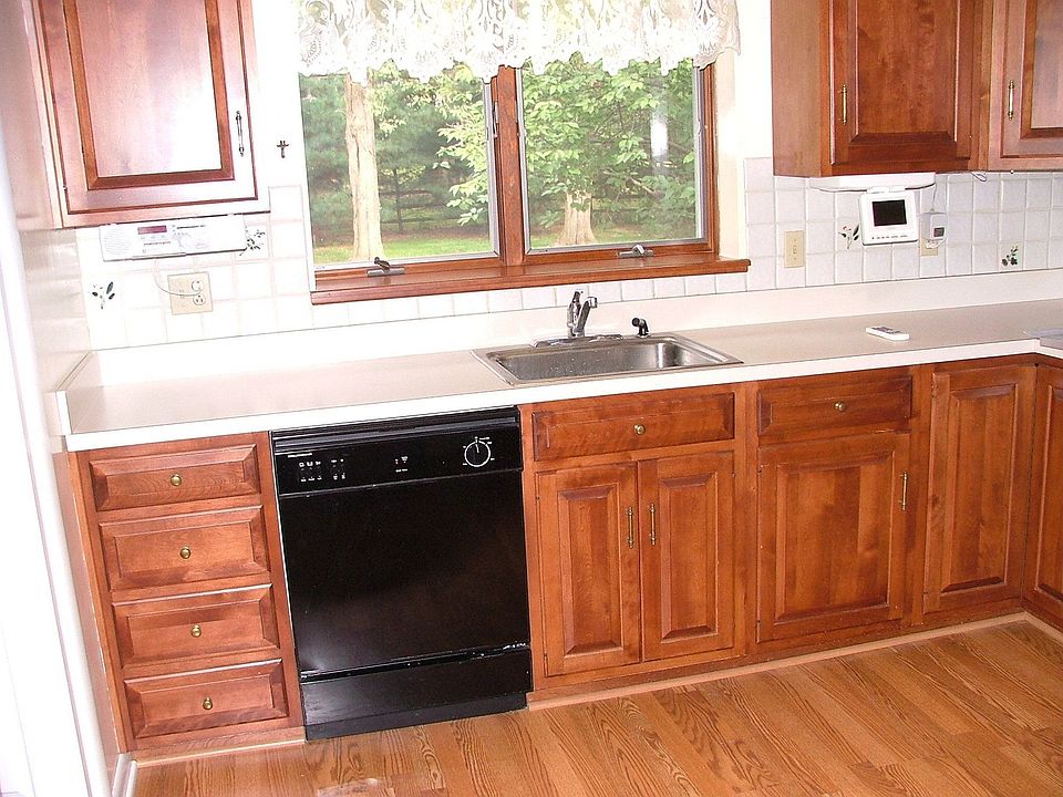 Quality Cherry Cabinets and New Kitchen applicances included.