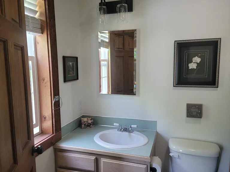 Master bathroom has sink, toilet, bathtub/shower.
