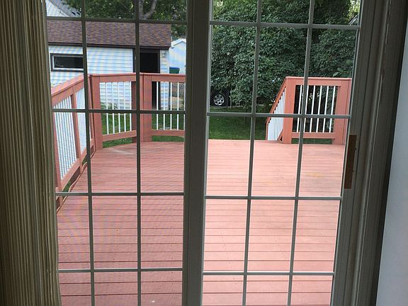 Large maintenance free deck in fenced back yard