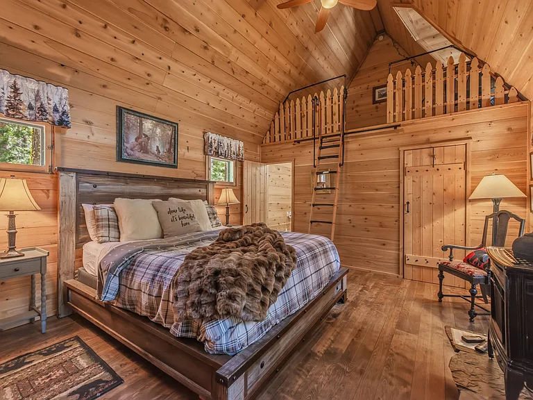 Bedroom 1: Primary Suite with Cal King, En-Suite Bathroom and thermostat controlled gas stove / fireplace.