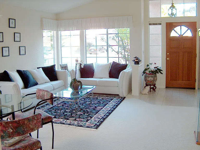 Living/dinning rm combo(furniture/carpet for reference only). Carpet replaced with luxury vinyl planks.