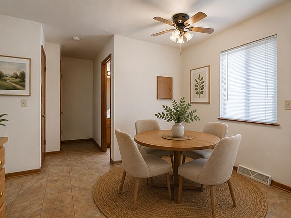 Dining area, virtually staged. Pantry included. 1/2 bathroom on main floor is down the hallway