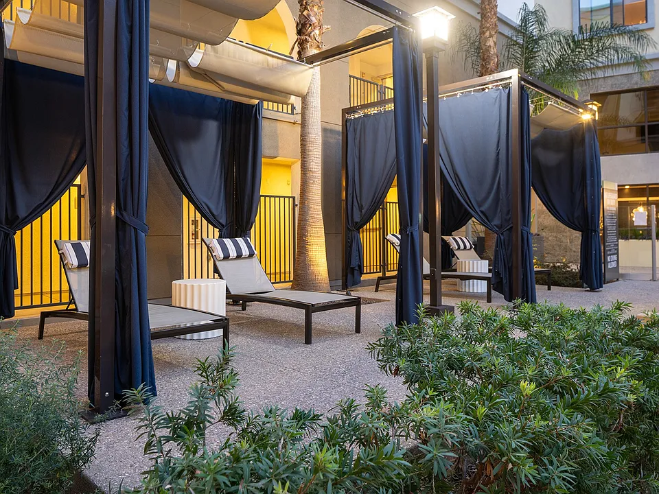 Sundeck with ample loungers and poolside cabanas