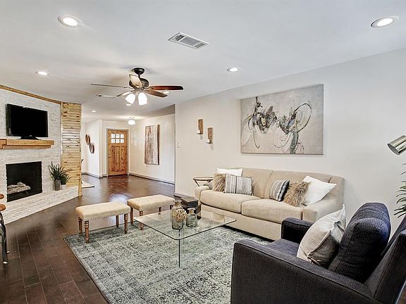 Central living area redesigned to open up to the kitchen and dining.