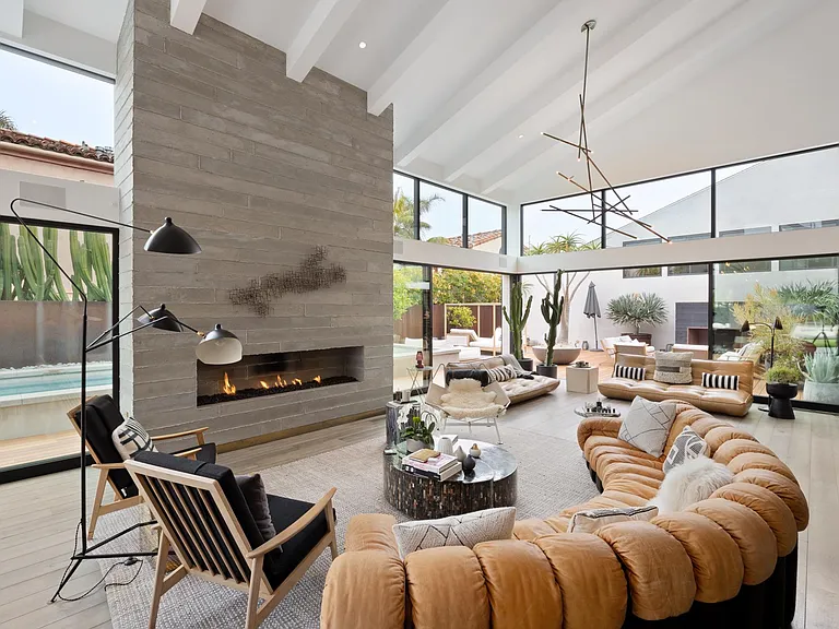 The pool table is situated to allow a fresh breeze to flow as you play.
Take a seat on the designer couch and hear the sound of the fire crackling.