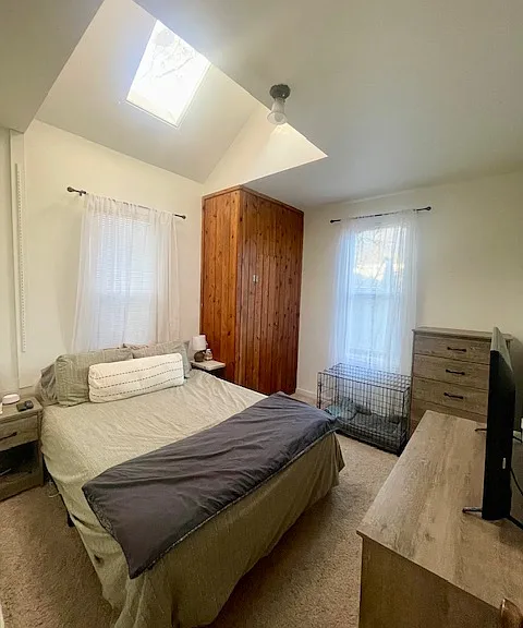 Main bedroom with cedar closet and skylight.