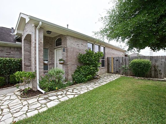 Where mature landscaping and custom flagstone pathways will greet your guest and family alike ....We