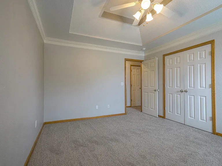 His and her closets in primary bedroom