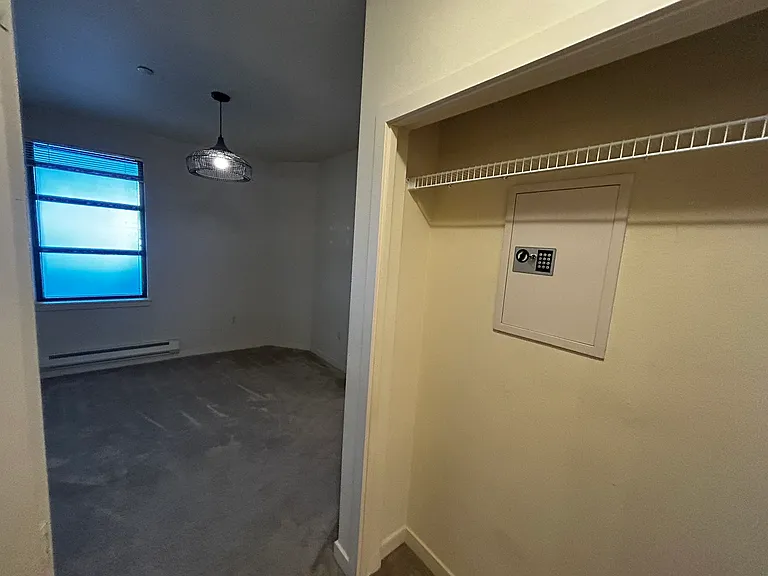 Other side of closet has a safe with shallow shelving. We placed our dresser in this nook.
