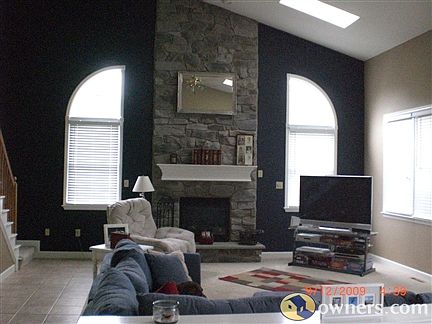 Large family room with vaulted ceilings, skylight and view