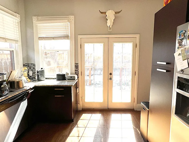Open the french doors to enjoy your lovely backyard.