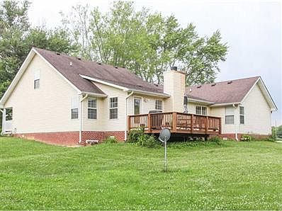 Exterior Back. 10 acres, large deck, full basement