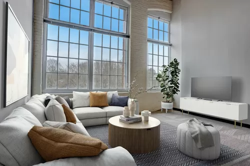 Living Room With Expansive Windows - The Residences at Slatersville Mill