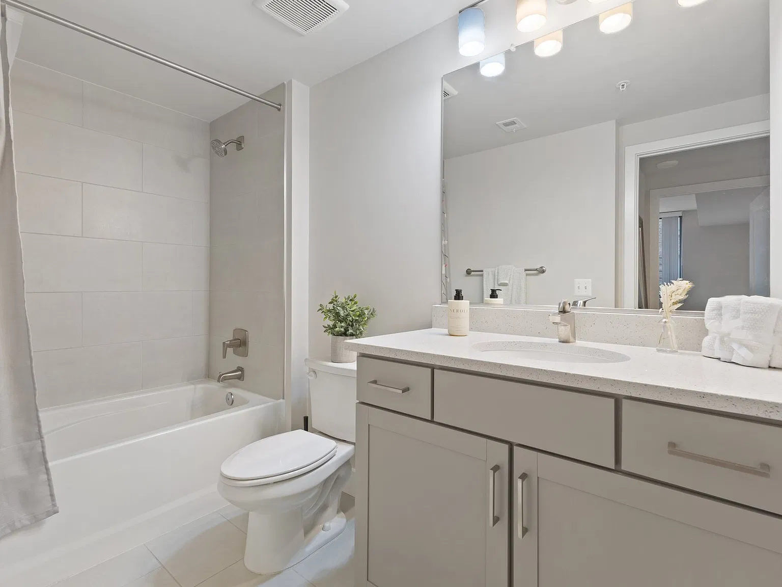 Bathroom with large vanity and mirror