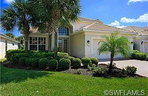 Lush landscaping and abundant glass give this home the Florida f