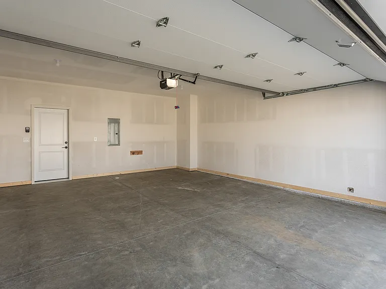 2-car garage with zero entry to main level.